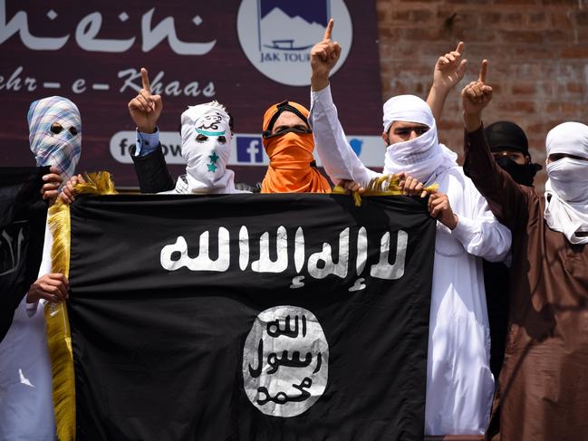 SRINAGAR, KASHMIR, INDIA, SRINAGAR, JAMMU AND KASHMIR, INDIA - 2019/06/05: Kashmiri Protesters hold an ISIS flag while making gestures during a protest in Srinagar. Indian forces in Srinagar used teargas smoke canisters and bullets to disperse hundreds of Protesters who took to streets after Eid-ul-Fitr prayers protesting against the Indian Rule in the region. (Photo by Idrees Abbas/SOPA Images/LightRocket via Getty Images)