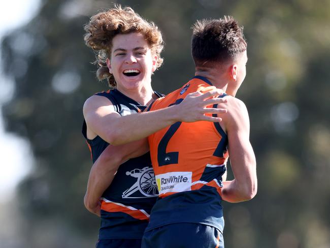 MELBOURNE, AUSTRALIA - MAY 23: Matthew Weber of the Cannons celebrates his match winning goal with teammate Zac Taylor during the NAB League match between the Calder Cannons and the Bendigo Pioneers at Highgate Reserve on May 23, 2021 in Melbourne, Australia. (Photo by Jonathan DiMaggio/AFL Photos/via Getty Images)