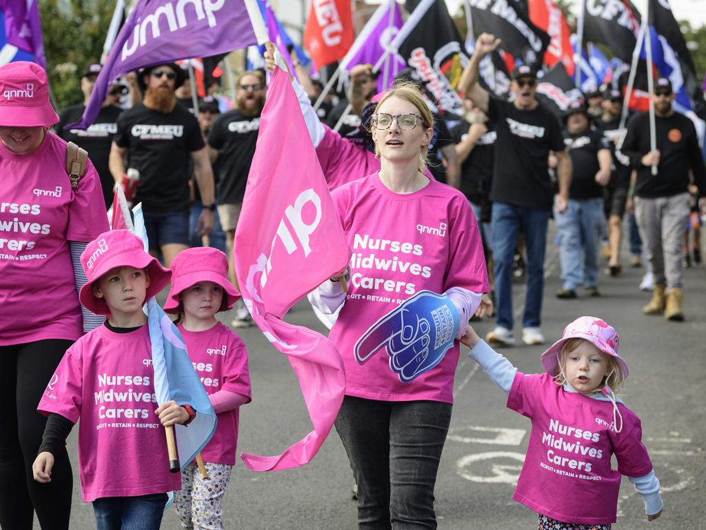 QNMU members including Morgan Slatter and daughter Charlotte (right) march in the Toowoomba Labour Day March, Saturday, May 3, 2025. Picture: Kevin Farmer