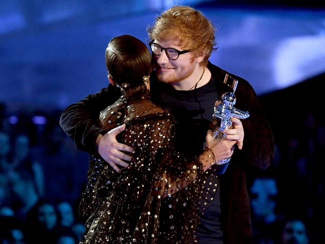 Ed Sheeran accepts the Artist of the Year award from Millie Bobby Brown onstage during the 2017 MTV Video Music Awards at The Forum on August 27, 2017 in Inglewood, California. Picture: Getty