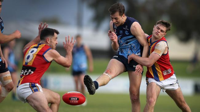 Glenunga’s Harry Prosser under pressure from Old Ignatians’ Hugh Ferrari and William Abbott in this season’s Adelaide Footy League division two grand final. The Rams were disappointed with their efforts. Picture: Dean Martin