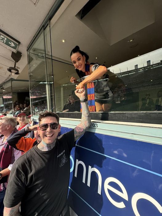 Launceston Mayor Matthew Garwood with Katy Perry at the 2024 AFL Grand Final who he invited to visit Tasmania now that she is a Tassie Devils supporter. Picture: supplied