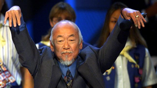 Actor Pat Morita re-enacts his Mr Miyagi 'crane' move from the Karate Kid movies. Bulldogs coach Luke Beveridge probably does it better. Picture: AFP