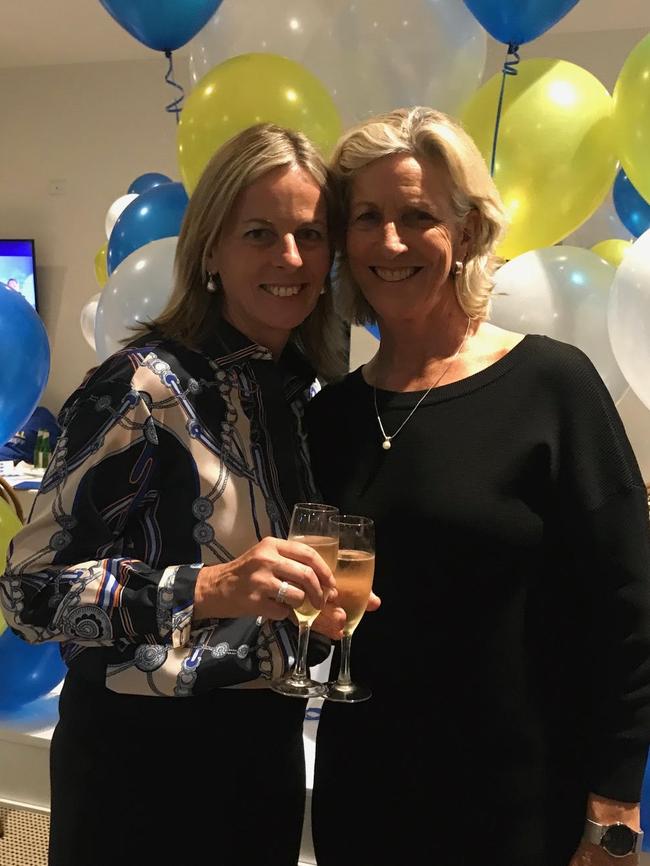 Angie Bell celebrates her victory in the seat of Moncrieff with her partner Ros Franklin.