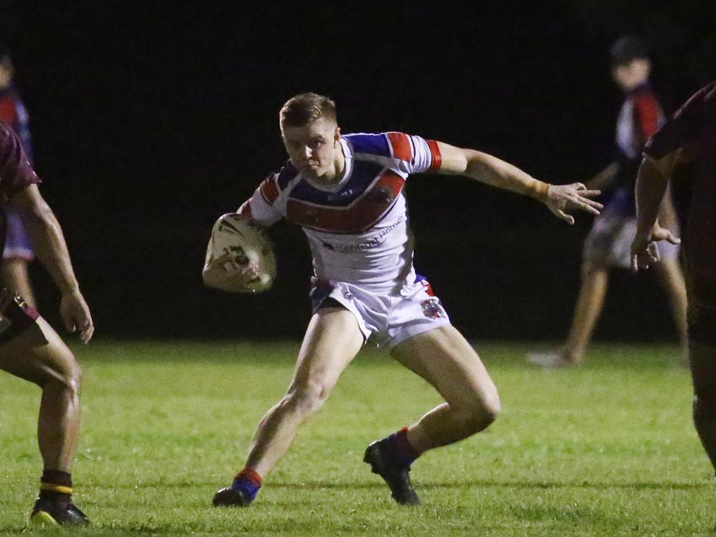 Knights' Stuart Fogilis finds a gap in the Cockatoo's defence in the Cairns and District Rugby League (CDRL) match between the Ivanhoe Knights and the Southern Suburbs Cockatoos, held at Smithfield. Picture: Brendan Radke