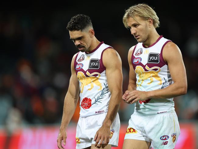 Dejected Lions pair Charlie Cameron (left) and Kai Lohmann reflect on Brisbane’s 54-point loss to the GWS Giants in April. Picture: Mark Metcalfe/AFL Photos/via Getty Images