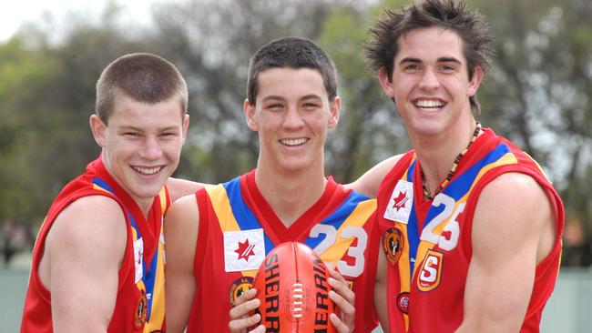 Bryce Gibbs, Mark Austin, and James Sellar while at Brighton in 2005. Gibbs has been named in the centre of the school’s all-time team and Sellar in the ruck, while Austin narrowly missed out on selection. Picture: Roger Wyman.