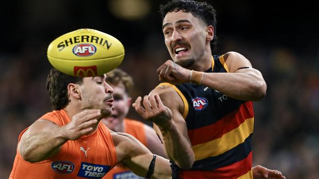 Crow Izak Rankine dishes out a handball against the Giants at Adelaide Oval in Round 16. Picture: Mark Brake/Getty Images