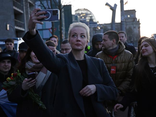 Yulia Navalnaya, widow of late Russian opposition figure Aleksei Navalny, does a selfie as the Reichstag stands behind after she voted in Russian elections in Berlin, Germany. Picture: Getty Images