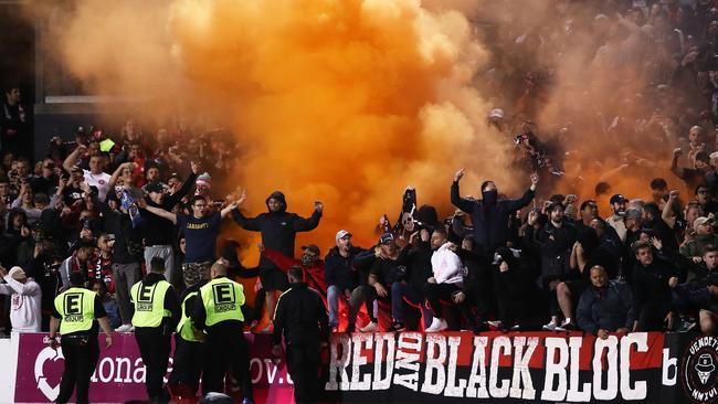 A flare is let off at Panthers Stadium on Saturday night. Picture: Getty Images