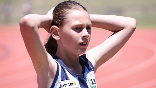 Hundreds of junior athletes will converge on Campbelltown Athletics Stadium for the zone carnival. Tired competitor after the Girls 800m. Photographer: Adam Yip