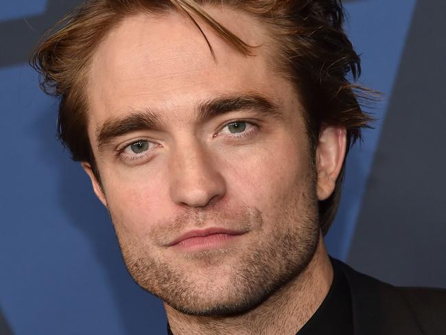 (FILES) In this file photo taken on October 27, 2019 British actor Robert Pattinson arrives to attend the 11th Annual Governors Awards gala hosted by the Academy of Motion Picture Arts and Sciences at the Dolby Theater in Hollywood. - Filming for the latest Batman-centered film, starring Robert Pattinson, has been halted in Britain after the actor reportedly tested positive for the coronavirus, just days after shooting had resumed. "A member of 'The Batman' production has tested positive for Covid-19, and is isolating in accordance with established protocols," Warner Bros. said in a statement to AFP. "Filming is temporarily paused." (Photo by Chris Delmas / AFP)