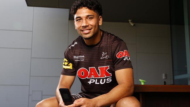 DAILY TELEGRAPH SEPTEMBER 27, 2022.  Panthers player Izack Tago with his flip phone during a media session at the Panthers Rugby League Academy. Picture: Jonathan Ng