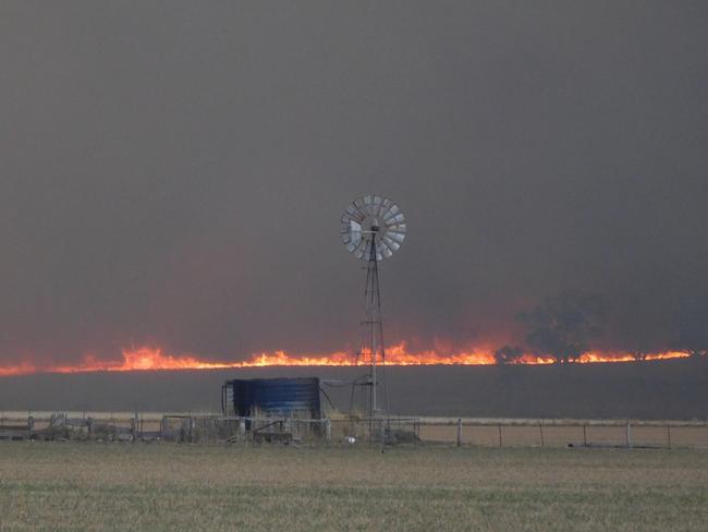The bushfire roars through the small town of Uarbry yesterday. Picture: Peter Gilmour.