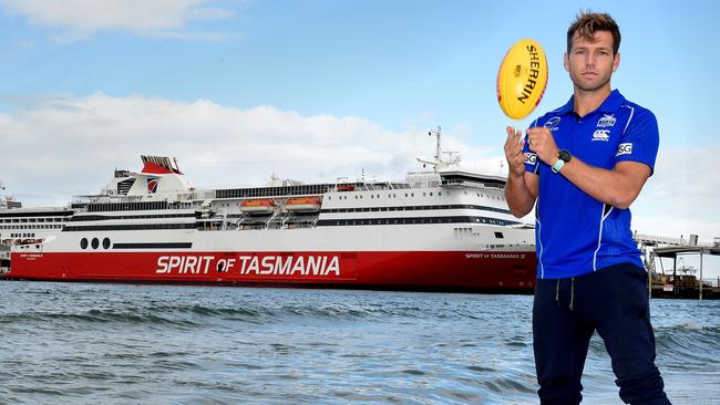 North Melbourne’s Shaun Higgins pictured next to the Spirit of Tasmania. The Kangaroos play three AFL games a year in Hobart. Picture: Nicole Garmston