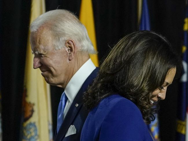 Joe Biden invites his running mate Kamala Harris to the stage. Picture: Getty Images.