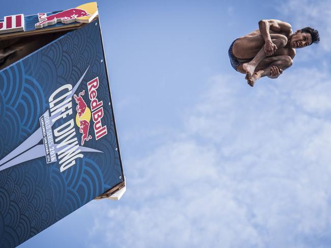 Sergio Guzman of Mexico diving from the 28 metre platform during the eighth stop of the Red Bull Cliff Diving World Series at Shirahama, Japan. Picture: AFP PHOTO / RED BULL / Jason HALAYKO