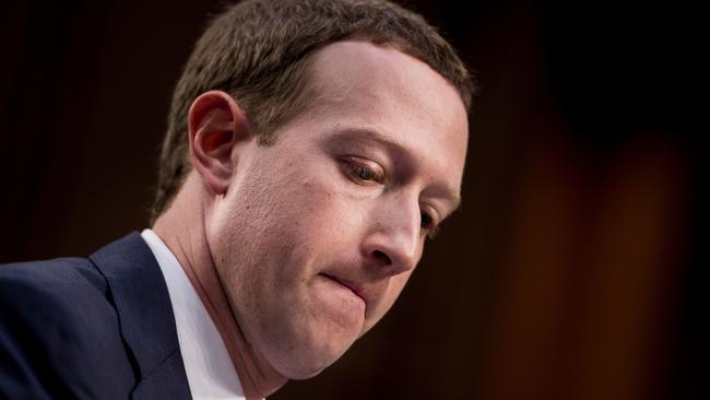 Mark Zuckerberg listens to one of his questioners. Picture; AFP.