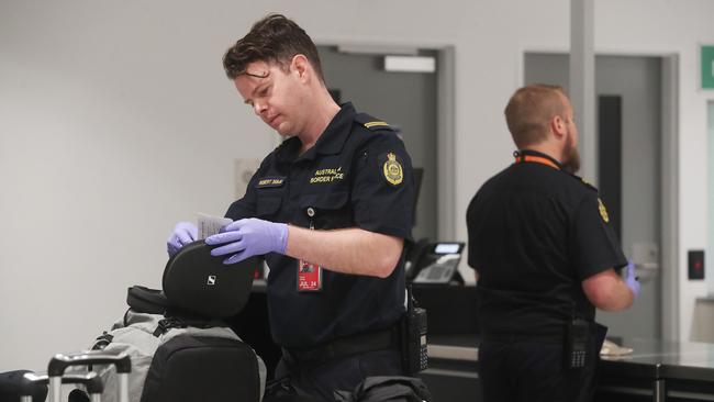 EMSearching luggage of a passenger on a flight arrival from New Zealand. Border Force at Hobart International Airport. Picture: Nikki Davis-Jones