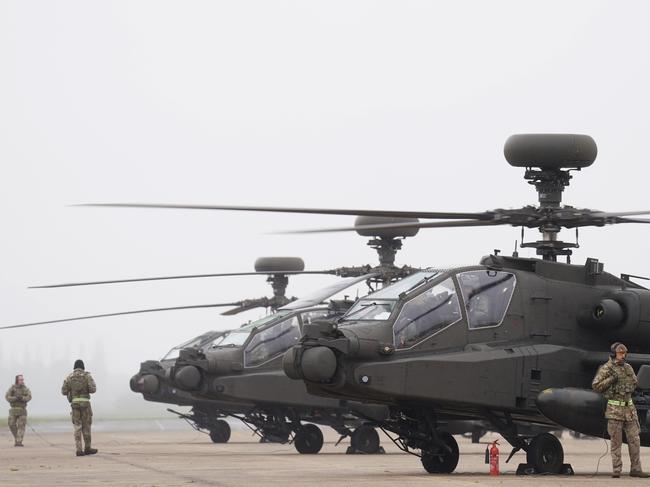 British Army Apache AH-64E attack helicopters are prepared for take off from Wattisham Flying Station in Suffolk, before heading to Estonia to train alongside Nato allies on Exercise Steadfast Defender 24. The fleet of new attack helicopters will be joined by Wildcat reconnaissance helicopters and RAF Chinook support helicopters to join a Nato training exercise in Finland. The Apaches will fly strike missions in support of large-scale Finnish Army training, before heading to Estonia for a further exercise where they will be joined by more British helicopters. The training exercise with the Apache attack helicopters in Finland is called Exercise Arrow, with the exercise in Estonia - with all three types of helicopter - called Exercise Swift Response. Picture date: Tuesday April 23, 2024. (Photo by Joe Giddens/PA Images via Getty Images)