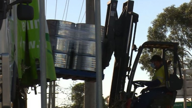 Drums are lifted into police trucks. Picture: Supplied