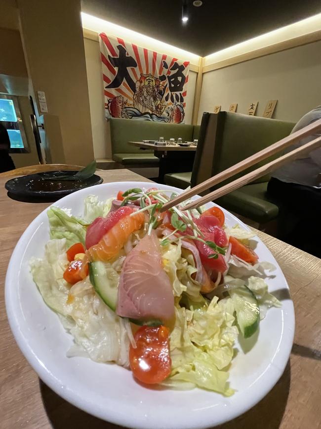 Touka salad (garden salad with sashimi) has plenty of iceberg lettuce.