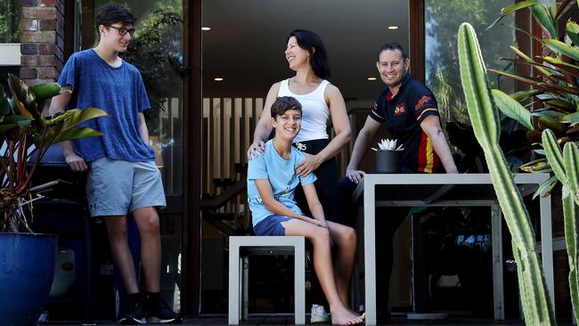 Michael Hercock, right, and Joanne Hardy — with children Jude, 13, and Sam, 16, — sold their terrace in Sydney’s Glebe for $1.7m, $100,000 over the reserve, but must now find a new home in a ­booming market. Picture: Jane Dempster