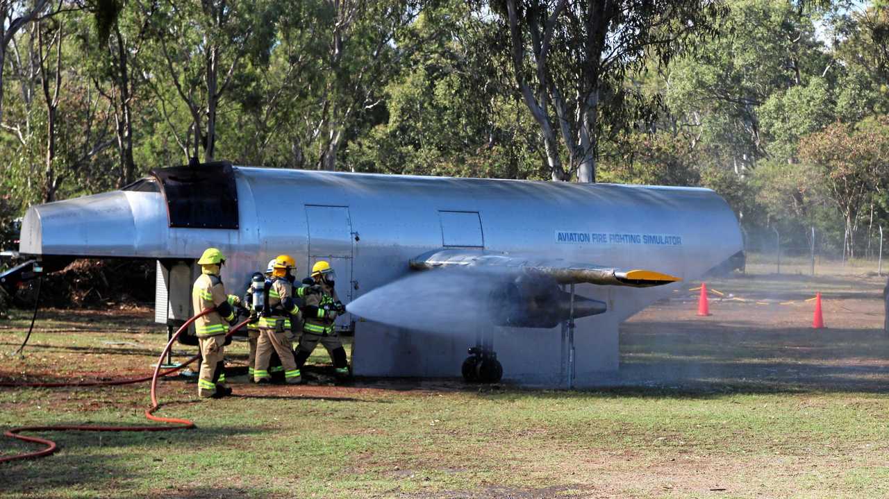 Rural Fire Service crews show off their skills in a simulated plane crash where the engine caught fire. Picture: Shayla Bulloch