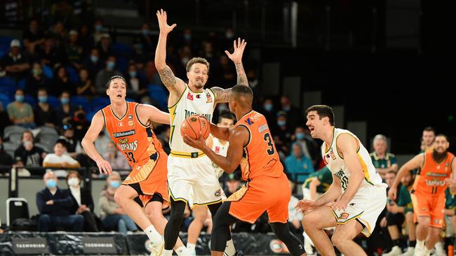 Taipans’ Scott Machado is guarded by JackJumpers’ Josh Adams as looks to pass to teammate Stephen Zimmerman in the NBL Blitz match at MyState Bank Arena. (Photo by Steve Bell/Getty Images)