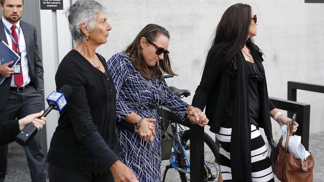 The family of deceased (Greg Dufty), pictured walking out of the Supreme Court, Brisbane 28th of May 2018. July 2015 Greg Dufty was murdered by a group of men in the Gold Coast hinterland. (AAP Image/Josh Woning)