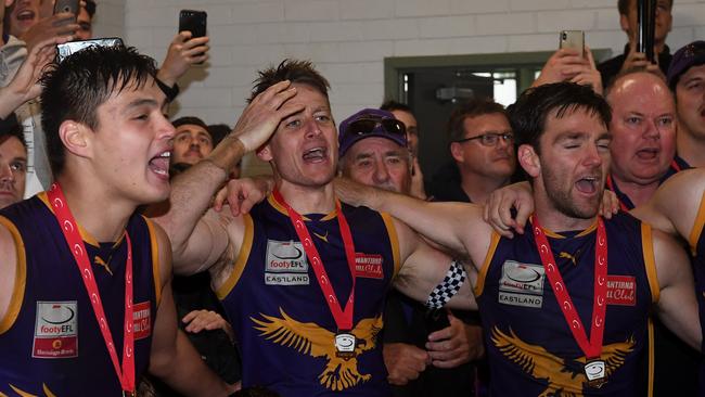 Ryan Mullett (centre) of Vermont is seen in the rooms after winning the EFL Premier division Grand Final, at Bayswater Oval, Melbourne, Saturday, September 21, 2019. Vermont VS Blackburn. (AAP Image/James Ross) NO ARCHIVING