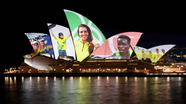 Peter Bol pictured on the Sydney Opera House with fellow Olympians. Picture: Damian Shaw