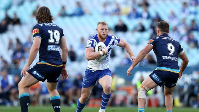 SYDNEY, AUSTRALIA - SEPTEMBER 05: Luke Thompson of the Bulldogs is tackled during the round 17 NRL match between the Canterbury Bulldogs and the Gold Coast Titans at ANZ Stadium on September 05, 2020 in Sydney, Australia. (Photo by Matt King/Getty Images)