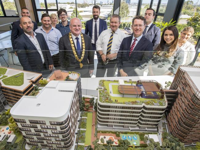 Parramatta Council, PAYCE and UTS team members with a model of the Melrose Park development. Picture: George Gittany Photography