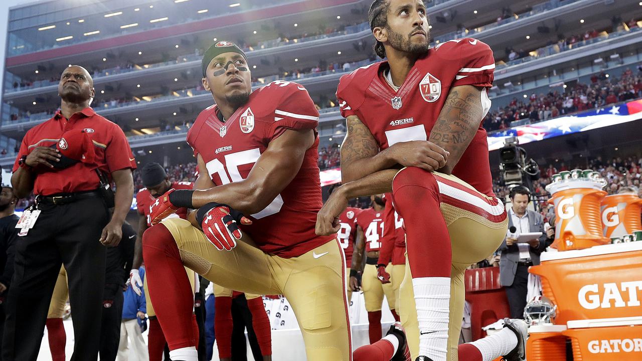 The first player to protest by kneeling during the anthem was Colin Kaepernick (right). Picture: AP