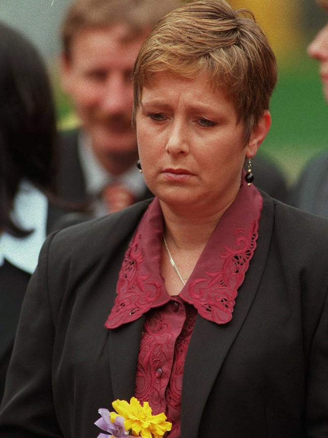 Lynne Beavis grieves outside Victoria's parliament in memory of the Port Arthur massacre victims in 1998.