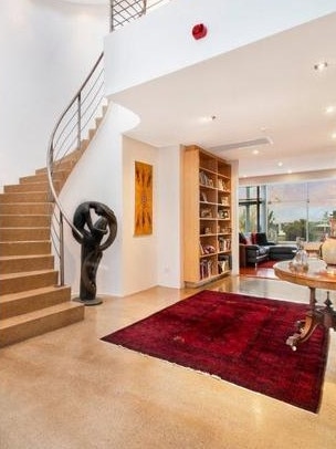 A spiral staircase leads to the bedroom. Picture: Realestate.com