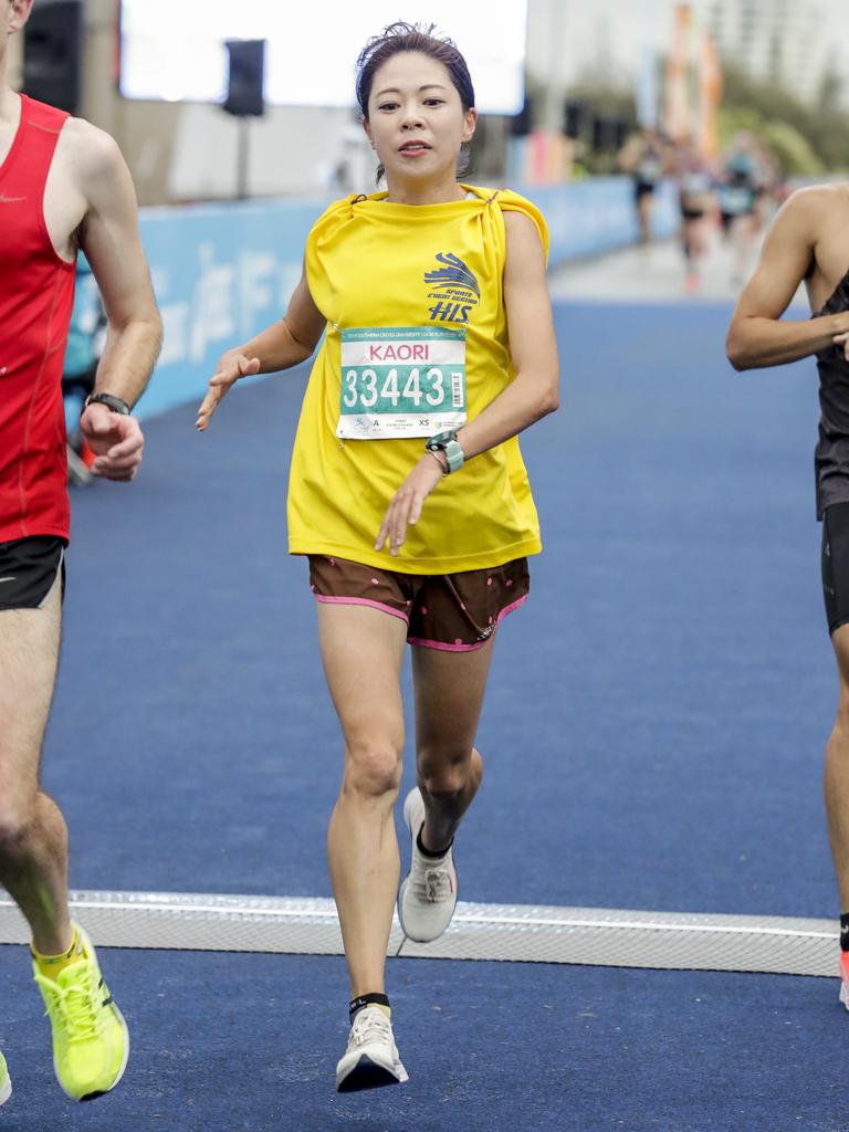 Kaori Yoshida crosses the finish line of the Southern Cross University ten kilometre Run. Picture: Tim Marsden.