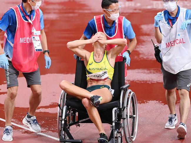 TOKYO, JAPAN - AUGUST 04: Genevieve Gregson of Team Australia reacts as she is wheeled off injured during the Women's 3000m Steeplechase Final on day twelve of the Tokyo 2020 Olympic Games at Olympic Stadium on August 04, 2021 in Tokyo, Japan. (Photo by Matthias Hangst/Getty Images)