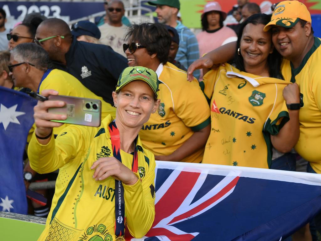 CAPE TOWN, SOUTH AFRICA - FEBRUARY 26: Meg Lanning of Australia poses for a selfie with fans following the ICC Women's T20 World Cup Final match between Australia and South Africa at Newlands Stadium on February 26, 2023 in Cape Town, South Africa. (Photo by Mike Hewitt/Getty Images)