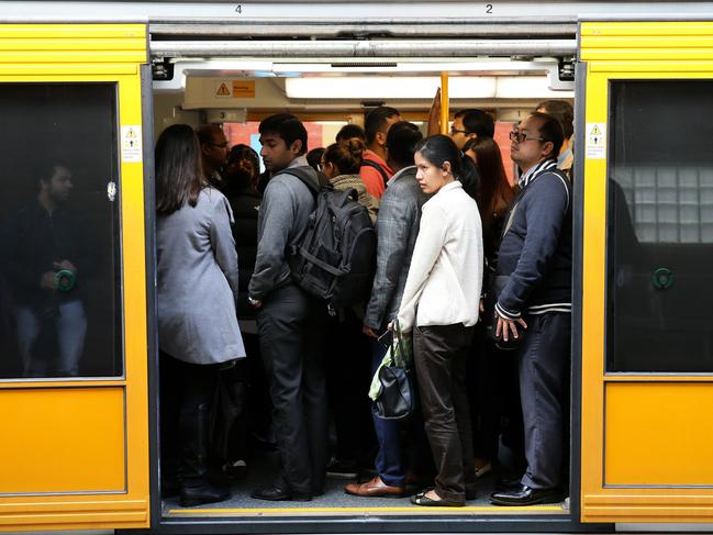 Overcrowded Trains from Parramatta to Central. Female Passenger trying to board a crowded train at Parramatta station.