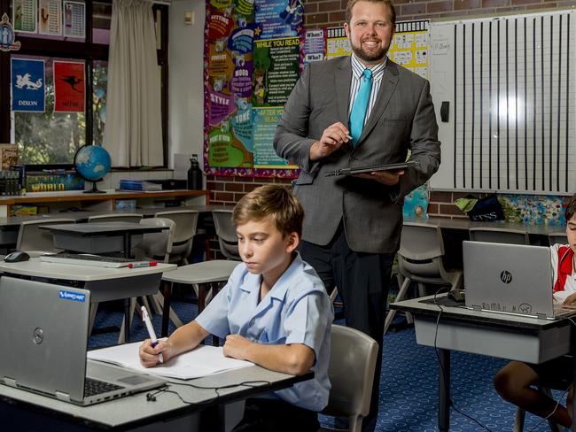 TSS (The Southport School) teacher profile. Year 5 classroom teacher Joshua Beecher, with students, John (front) and Roman (right)   Picture: Jerad Williams