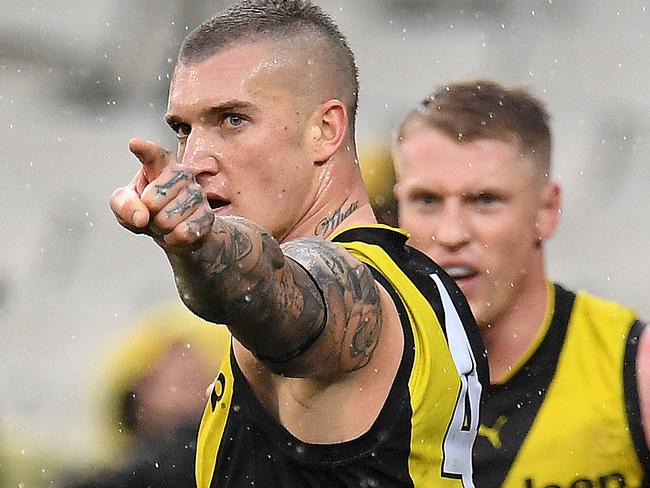 Dustin Martin of the Tigers (left) points to a teammate during the Round 18 AFL match between the Richmond Tigers and the Greater Western Sydney Giants at the MCG in Melbourne, Sunday, July 23, 2017. (AAP Image/Julian Smith) NO ARCHIVING, EDITORIAL USE ONLY