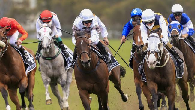 Hugh Bowman and I'm Thunderstruck (white blinkers) surge late to claim the $7.5 million Golden Eagle at Rosehill Gardens. Picture: Getty Images