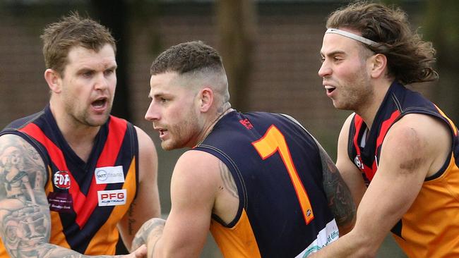 Victor Micallef celebrates a goal with teammates on Saturday. Picture: Hamish Blair