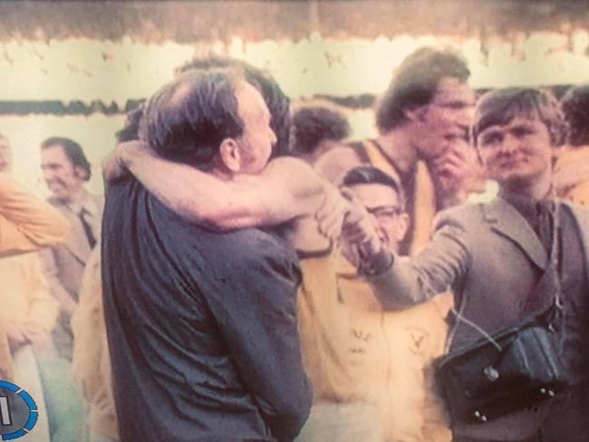 Macca, from Mount Waverley, shaking John Kennedy Sr's hand while impersonating a TV cameraman, after Hawthorn won the 1976 VFL Grand Final.