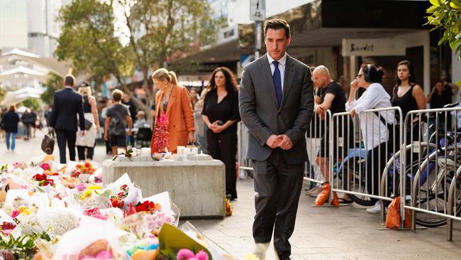 Scentre Group chief executive Elliott Rusanow pays his respects at Westfield Bondi Junction on Monday. Picture: David Swift