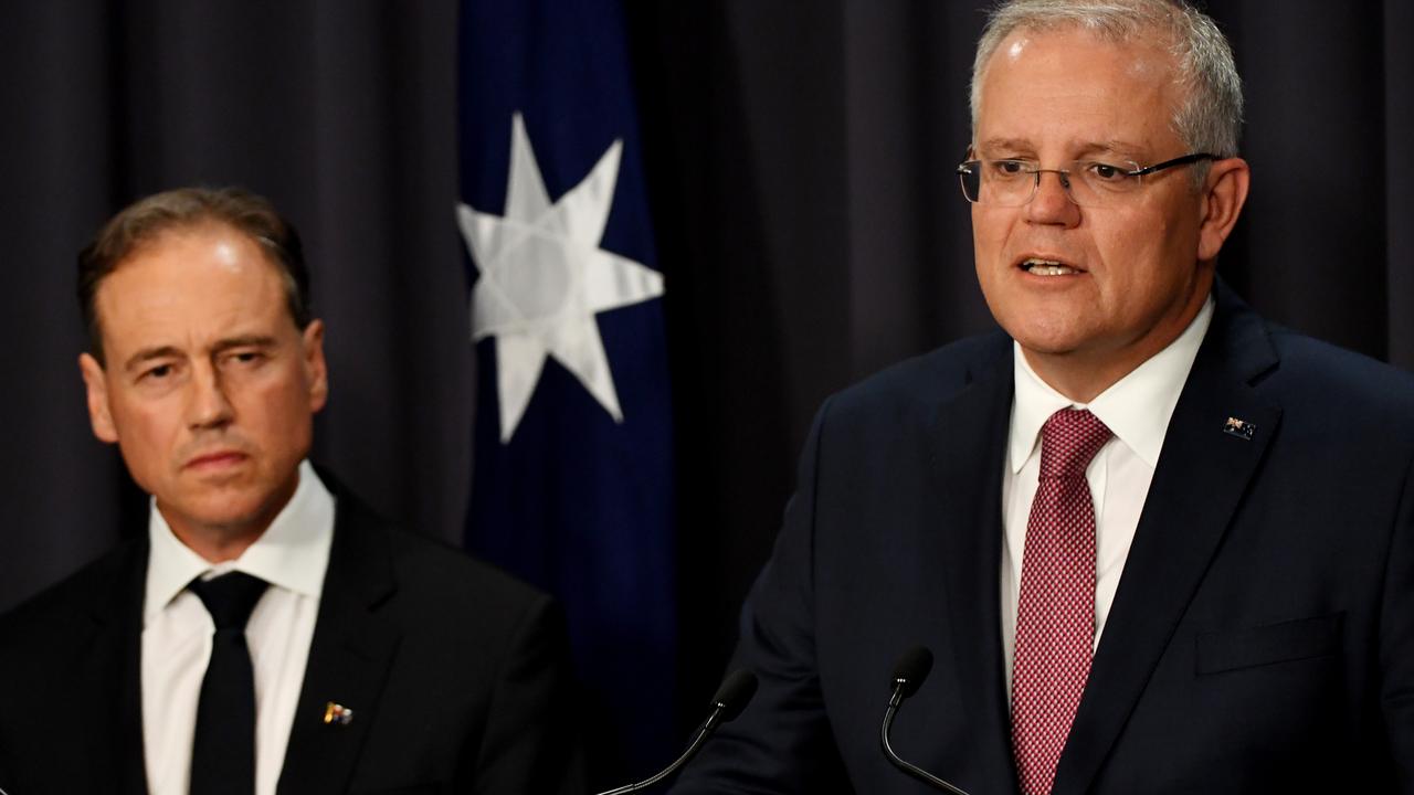 Australian Health Minister Greg Hunt (left) and Australian Prime Minister Scott Morrison are reportedly in talks about further travel restrictions. Picture: Tracey Nearmy/Getty Images.