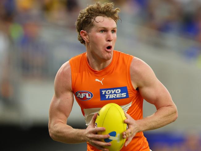 PERTH, AUSTRALIA - MARCH 24: Tom Green of the Giants looks for options as he runsdown the field during the round two AFL match between West Coast Eagles and Greater Western Sydney Giants at Optus Stadium, on March 24, 2024, in Perth, Australia. (Photo by James Worsfold/AFL Photos/via Getty Images )