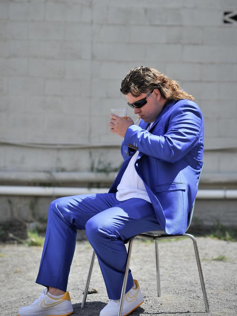 Dane Wildley is seen during Mulletfest, a special event designed to celebrate the hairstyle that's all about business at the front, party at the back, Chelmsford Hotel, Kurri Kurri9. (AAP Image/Perry Duffin) 